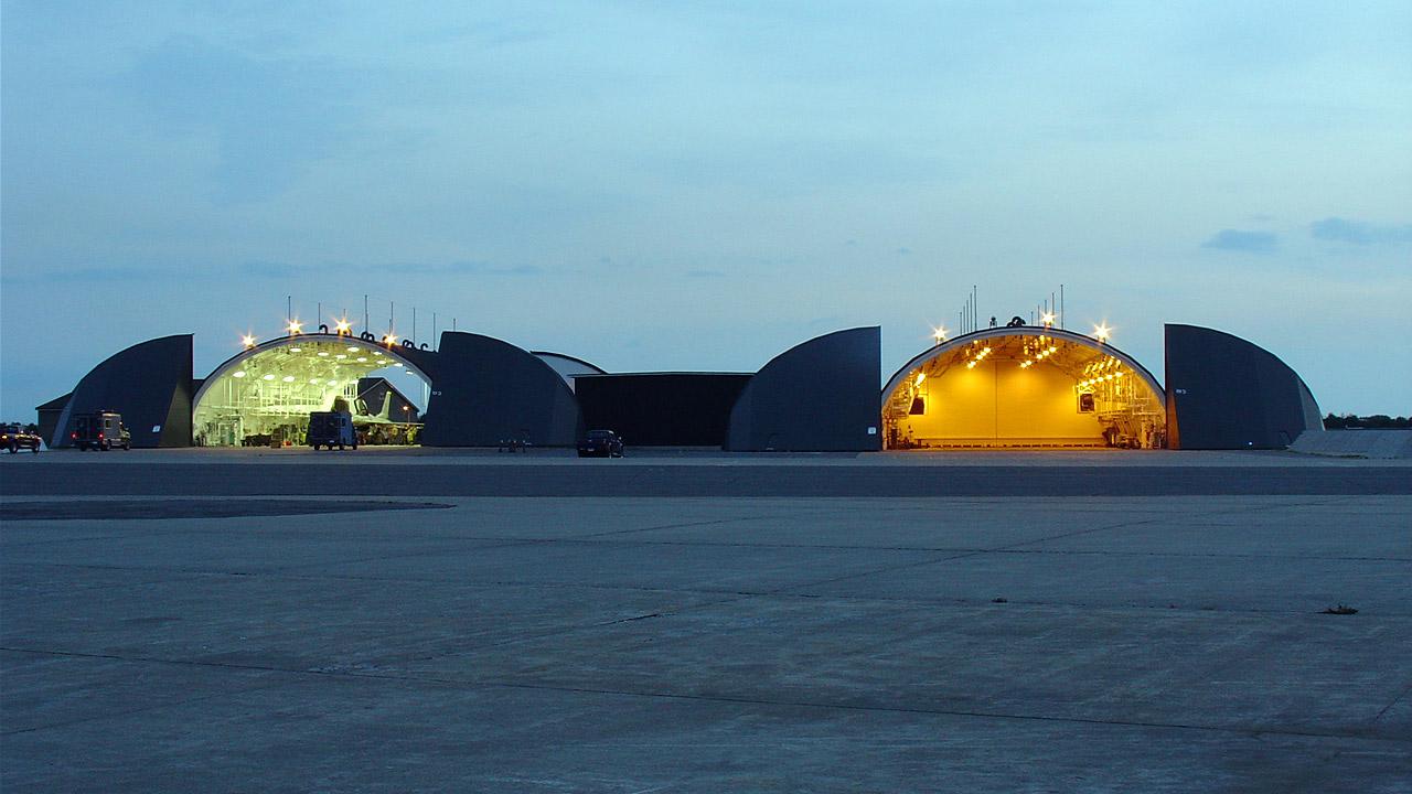 Two aircraft hangars on an airfield base