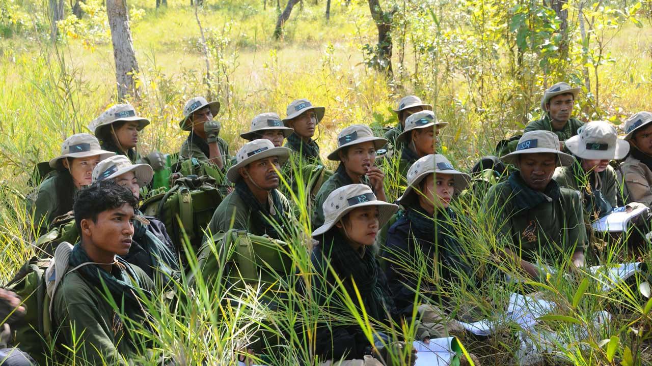 A group of community members receiving community scouts skills training to support Protected Area patrolling